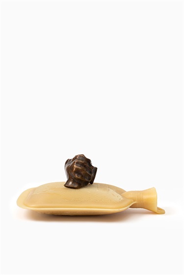Anita Johnson, Holding care, beeswax with bronze cast of the space between the artist's cupped hands, 19 x 35 x 22 cm. Appears courtesy of Defiance Gallery.