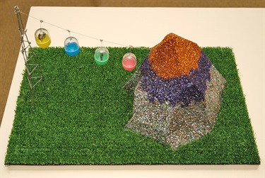 Eleanor Avery, Mount Fantastic, MDF, glitter, AstroTurf, wire, card, plastic capsules, worry doll, 25 x 45 x 29 cm.