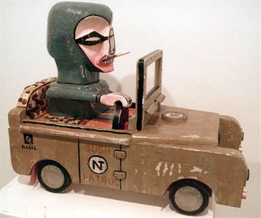 Franck Gohier, Bush Patrol, carved ironwood, packing case, tin cans, nails, buttons, bottle caps, Perspex, acrylic paint, nails, 60 x 35 x 50 cm. Courtesy of Ray Hughes Gallery.