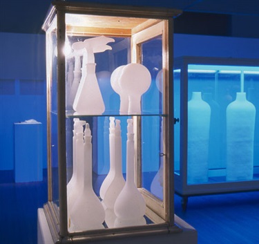 Michelle Perrett, Wax Cabinet II, wax objects, wooden cabinet, lighting, 36 x 48 x 67 cm. Courtesy of Tim Olsen Gallery.