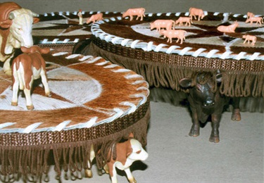 Steven Fasan, The Bovine Suit - The Lesson Rawhide MOOOOO, hobby figures/cattle, cowhide, material fringe, 70 x 70 x 15 cm.