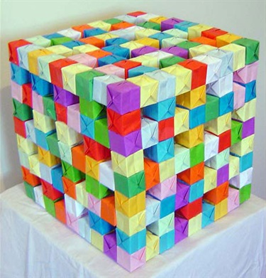 Kate Mackay, Folded Cube, paper, PVA glue, 35 x 35 x 35 cm.
