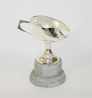 Elvis Richardson, The impossibility of losing in the mind of someone winning, found burnt and re-silvered trophy, cement base, 16 x 15 x 10 cm. Courtesy of Hugo Michell Gallery.