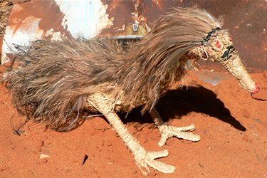 Impiti Winton, Kipara Wipiatjara (Bush Turkey with Feathers), raffia, emu feathers, 38 x 29 x 72 cm. Courtesy of Tjanpi Desert Weavers.
