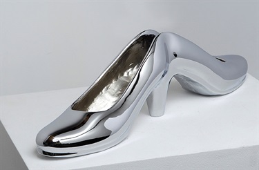 Julie Rrap, Stasis Symbol, bronze, silver chrome, 15 x 53 x 10 cm. Courtesy of Roslyn Oxley9 Gallery.