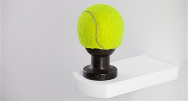 Kenzee Patterson, Tennis Ball/Tow Ball, cast bronze, tennis ball, 10 x 6 cm. Courtesy of Darren Knight Gallery.