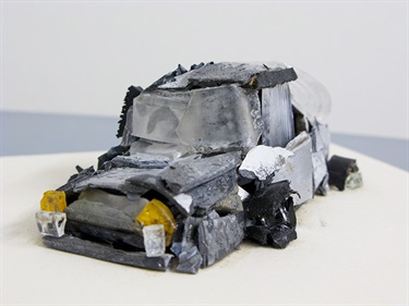 Tim Woodward, Accidents Happen vs. Accidents Don't Happen, found windscreen glass, lead, rubber, steel, plastic, burnt tyre tread, headlight, 26 x 19 x 11 cm.
