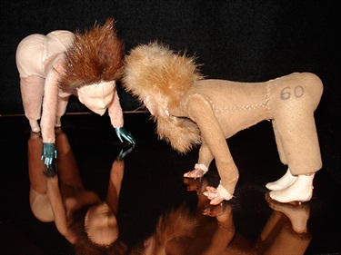 Anne Griffths, Antony's Demons, plastic toy parts, animal skin, fur, acrylic mirror, foam core, 30 x 30 x 10 cm.