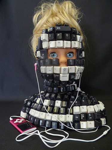 Belinda Holloway, LOL Not, plastic doll bust, computer keys, MP4 player, computer wire, 40 x 30 x 20 cm.