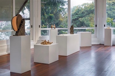 Exhibition space with sculptures on display