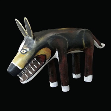 Jack Bell, Ku-Camp Dog, acrylic and natural ochres on milkwood, 39 x 70 x 15 cm. Courtesy of Coo-ee Aboriginal Art Gallery.