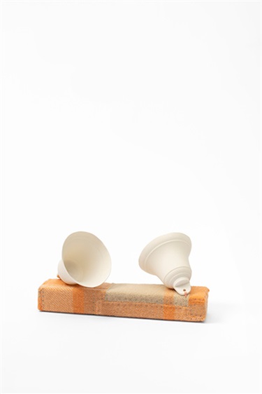 Liss Finney, A silent echo (soft longing), felt, porcelain, foam, steel pins, 15 x 25 x 15 cm.