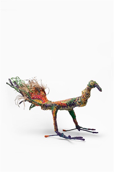 Tricia Singer, Peacock, tjanpi (native desert grasses), rusty steel and galvanised wire, wipya (emu feathers), raffia, acrylic wool, 55 x 57 x 80 cm. Appears courtesy of Tjanpi Desert Weavers.